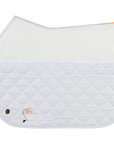 Perfecto friction shield saddle pad in white with a quilted fabric on the top and smooth fabric on the top and a silver Jackie&Co lucky numbers pin on the bottom left.