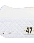 A friction shield saddle pad with competition numbers held in place by lucky numbers pins.