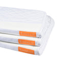 A stack of three friction shield saddle pads showing the orange Jackie&Co tag along the top seam.