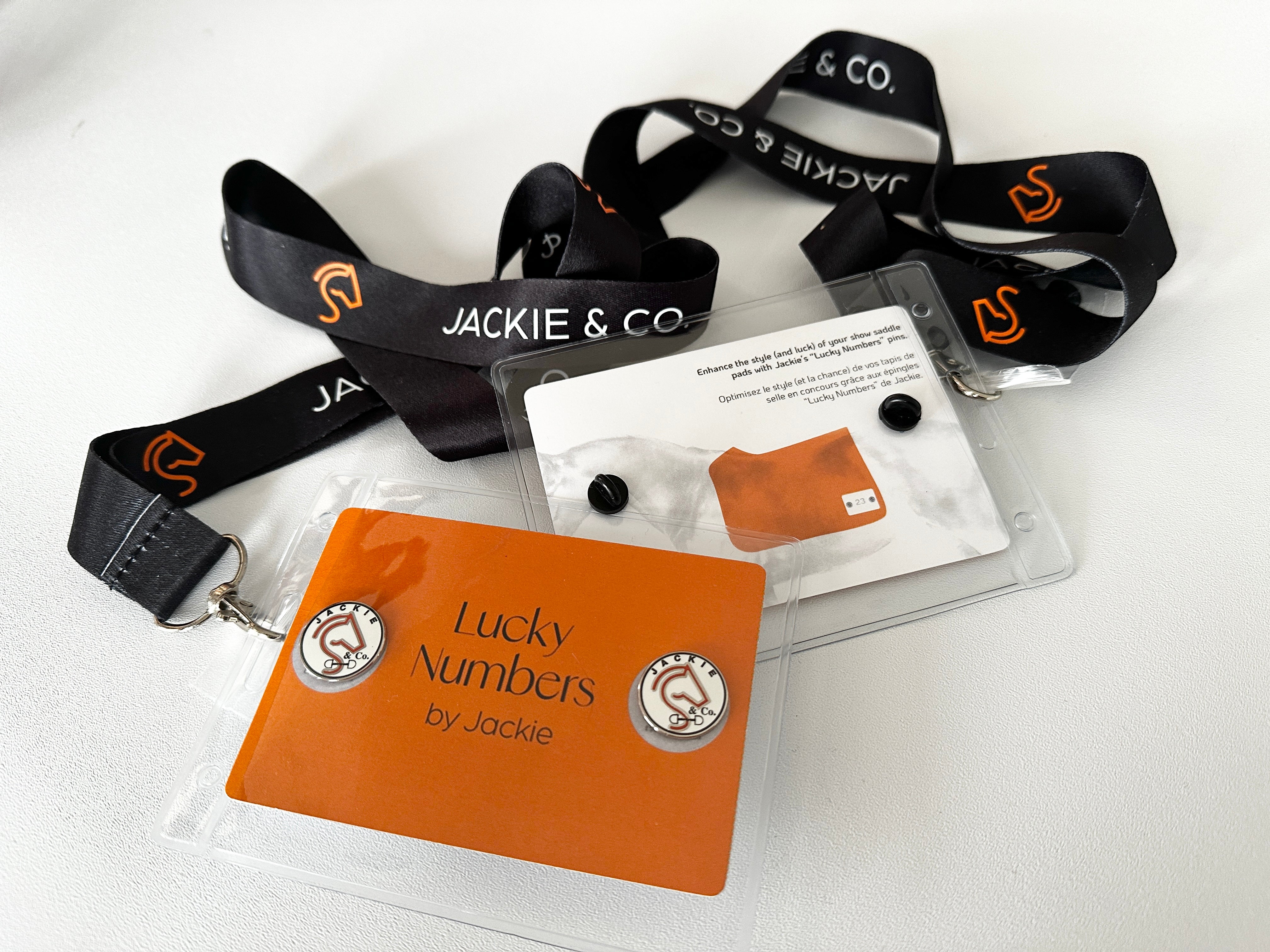 Jackie&Co black lanyards with white lucky number pins. 